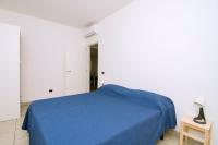 A bed or beds in a room at Brezza dell'Alento