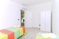 A bed or beds in a room at Brezza dell'Alento