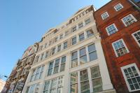 a large white building with windows on a street at 196 Bishopsgate in London