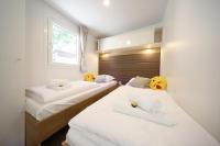Posteľ alebo postele v izbe v ubytovaní ESTRADA mobile home