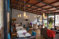 a restaurant with tables and chairs in a room at Union Hotel Cusco in Cusco