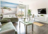 Televízia a/alebo spoločenská miestnosť v ubytovaní Atarazanas Apartment by Sol Maestranza