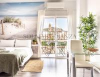 Posteľ alebo postele v izbe v ubytovaní Atarazanas Apartment by Sol Maestranza