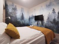 Posteľ alebo postele v izbe v ubytovaní Apartament "Nad dachami"