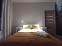 Posteľ alebo postele v izbe v ubytovaní Apartament "Nad dachami"