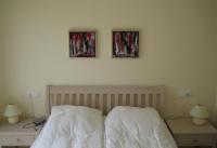 A bed or beds in a room at Casa de Sonrisa