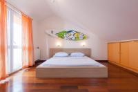 Posteľ alebo postele v izbe v ubytovaní Apartments Tino