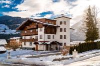 a large building with snow on the ground at Dachsteinblick in Schladming