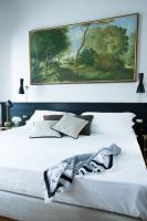 A bed or beds in a room at Soprarno Suites
