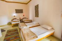 Postel nebo postele na pokoji v ubytování Seliyaa Siwa Inn Hotel