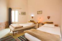 Postel nebo postele na pokoji v ubytování Seliyaa Siwa Inn Hotel