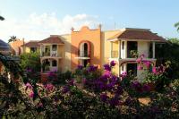 a house with purple flowers in front of it at Ecotel Quinta Regia in Valladolid