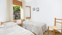 A bed or beds in a room at 1 Brav - Llafranc