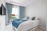 Posteľ alebo postele v izbe v ubytovaní Elite Apartments Sunny