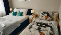 Posteľ alebo postele v izbe v ubytovaní Apartamenty gościnne na szlaku