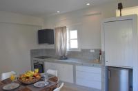 Kuchyň nebo kuchyňský kout v ubytování De_naxia Suites
