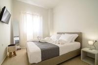 Postel nebo postele na pokoji v ubytování De_naxia Suites