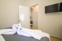 TV a/nebo společenská místnost v ubytování De_naxia Suites
