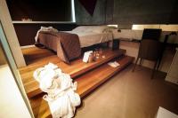 A bed or beds in a room at Gran Paradiso Hotel Spa