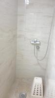 a bathroom with a shower with a toilet in it at Apartment 18 in Pančevo