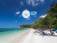 a beach with a sign that says sitzka plus at Sarikantang Resort & Spa, Koh Phangan in Haad Rin