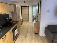 Kuchyňa alebo kuchynka v ubytovaní Apartamenty 'Okno z widokiem'