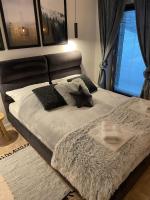 Posteľ alebo postele v izbe v ubytovaní Apartamenty 'Okno z widokiem'