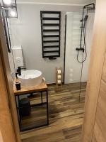 Kúpeľňa v ubytovaní Apartamenty 'Okno z widokiem'