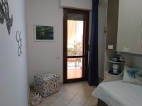 A bed or beds in a room at Rami di Corallo Appartamento con Parcheggio Privato ----------