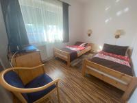 A bed or beds in a room at Bella apartman