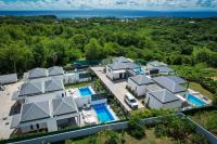 an aerial view of a house with a swimming pool at Tropic &amp; Chic in Sainte-Anne