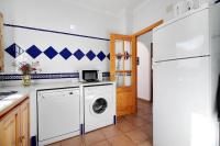 A kitchen or kitchenette at Caracola Apartment