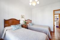 A bed or beds in a room at Caracola Apartment