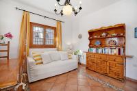 A seating area at Caracola Apartment