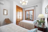A bed or beds in a room at Caracola Apartment