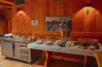 a kitchen with a table with food on it at Chalet-Hôtel de l&#39;Etape in Les Contamines-Montjoie