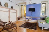 Televízia a/alebo spoločenská miestnosť v ubytovaní Monti Art Déco - design apartment