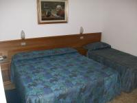 Posteľ alebo postele v izbe v ubytovaní HOTEL SANTOROTTO di FABIO TERROSI