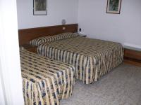 Posteľ alebo postele v izbe v ubytovaní HOTEL SANTOROTTO di FABIO TERROSI