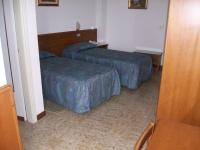 Posteľ alebo postele v izbe v ubytovaní HOTEL SANTOROTTO di FABIO TERROSI