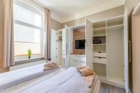 Postel nebo postele na pokoji v ubytování Haus Inselanker Kajüte 07