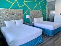 Ein Bett oder Betten in einem Zimmer der Unterkunft Inn at East Beach