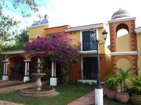 a house with a street light in front of it at Ecotel Quinta Regia in Valladolid