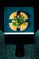 a blue plate with some food on top at Hôtel Le Café de Paris in Biarritz