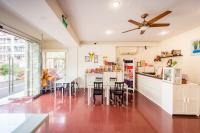 a kitchen with a dining area and a table with chairs at Moonlake B&amp;B in Yuchi