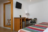 Postel nebo postele na pokoji v ubytování Hotel Don Curro