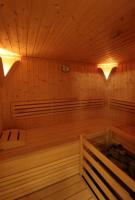 a sauna with wooden walls and a wooden floor at Panorama Chalet in Mittersill