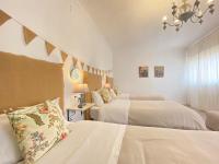 A bed or beds in a room at Casa Villamena