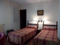 Postel nebo postele na pokoji v ubytování Hotel Termas de Liérganes