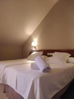 Postel nebo postele na pokoji v ubytování Hotel Olimpo